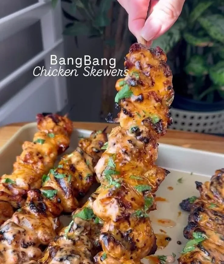 Delicious Bang Bang Chicken Skewers garnished and ready to serve