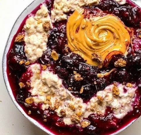 Delicious bowl of blueberry chia overnight oats topped with fresh blueberries