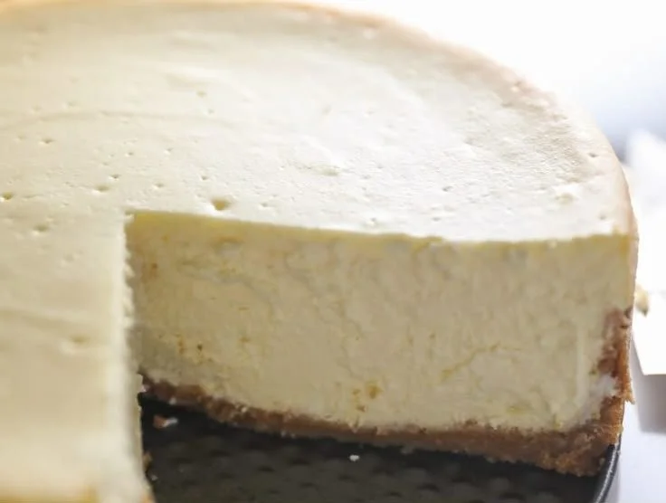 Delicious slice of homemade cheesecake with cherry topping