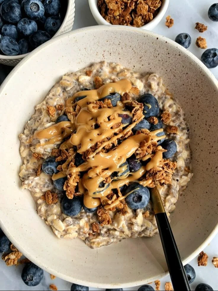 Bowl of classic overnight oats topped with fresh fruits and nuts