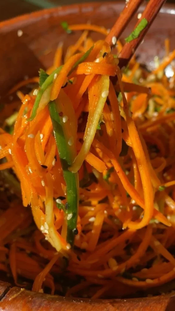 Fresh Cucumber Carrot Salad in a bowl with a colorful dressing