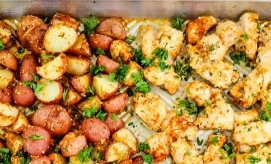 Garlic Parmesan Chicken with crispy potatoes, a flavorful dinner dish.