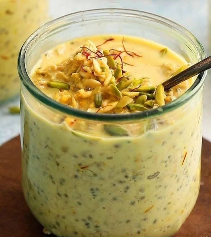 Bowl of Indian Style Overnight Oats topped with fruits and nuts