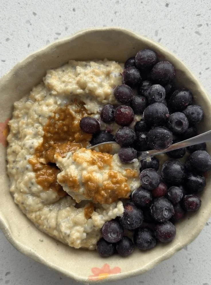 Bowl of the creamiest oats topped with fresh fruits and nuts for a nutritious breakfast