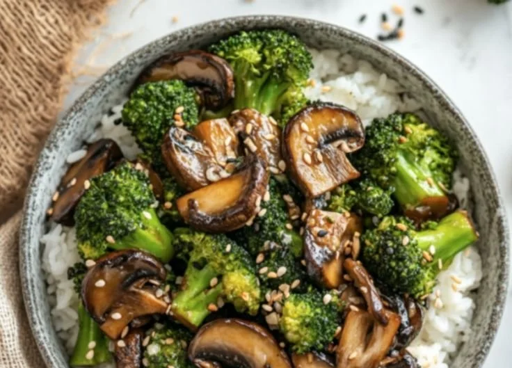 Delicious vegan broccoli and mushroom stir fry served in a colorful bowl.