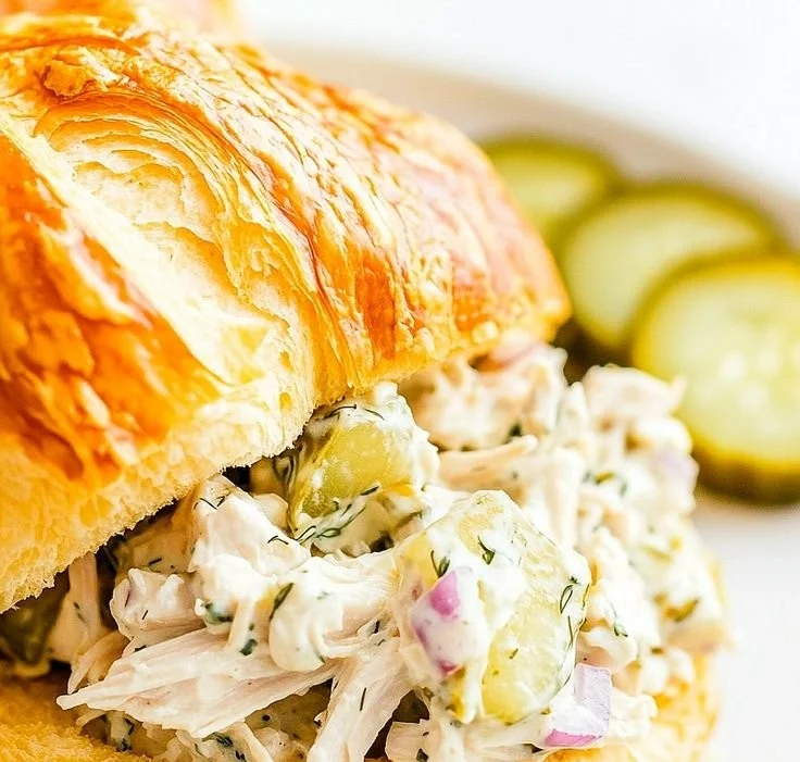 A bowl of flavorful dill pickle chicken salad with fresh ingredients