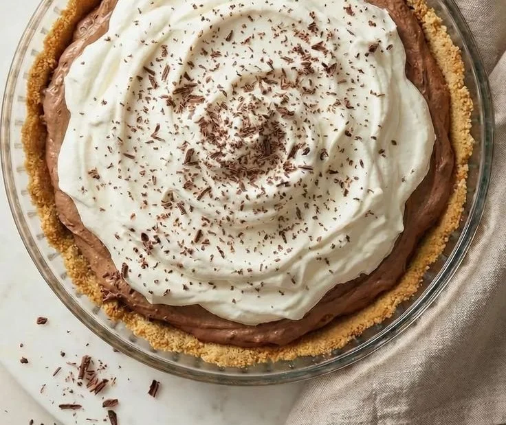 Delicious chocolate pudding pie with creamy filling and a flaky crust