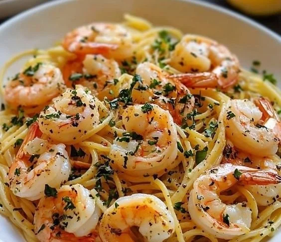 Delicious plate of shrimp scampi with lemon butter sauce and parsley garnish