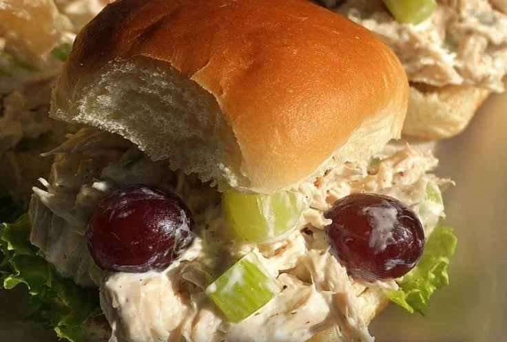 Delicious slider buns served with simple chicken salad on a plate