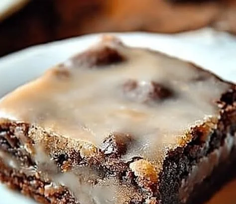 Delicious banana bread brownies topped with chocolate drizzle