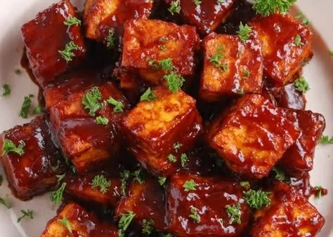 Grilled BBQ Tofu served with vegetables on a plate