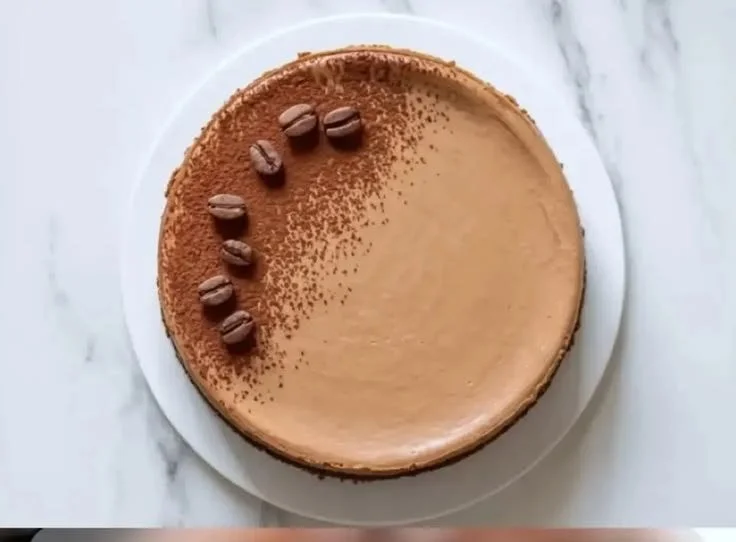 Delicious Cappuccino Mousse Cheesecake topped with coffee and chocolate.