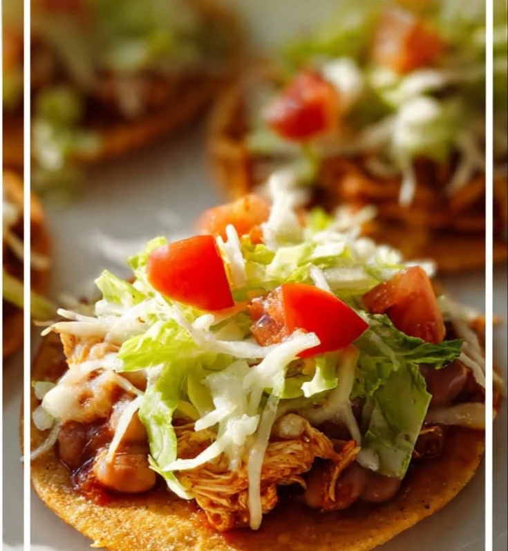 Delicious spicy chicken tostadas topped with fresh ingredients.