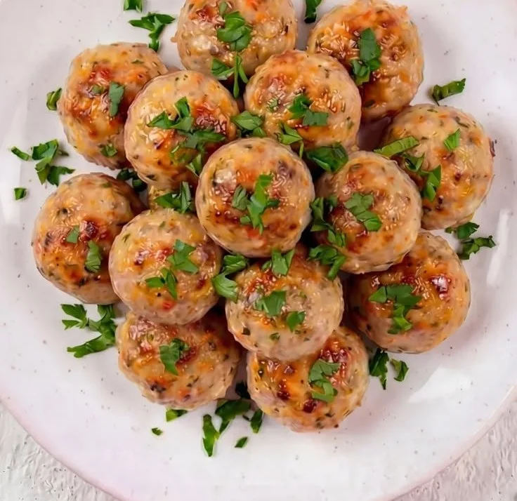 Delicious baked chicken meatballs on a serving platter