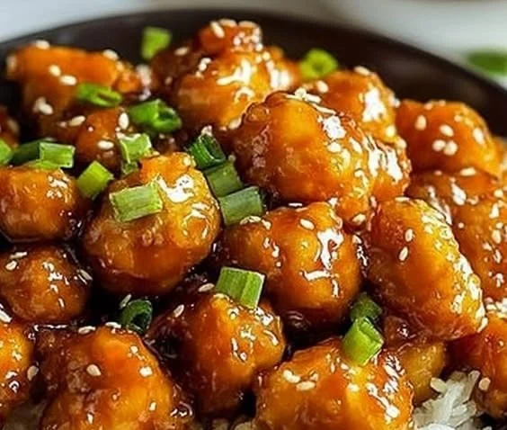 Gluten-free orange chicken served with broccoli and rice