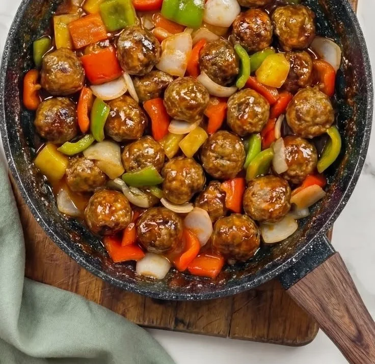 Delicious sweet and sour meatballs served in a savory sauce.