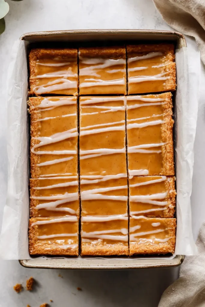 Homemade Brown Sugar Pop Tart Bars with cinnamon topping on a plate.