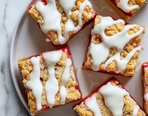 Delicious strawberry pie bars topped with fresh strawberries and crust.
